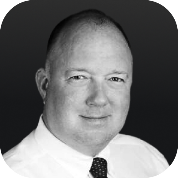 Headshot of a middle-aged bald man wearing a white shirt and patterned tie, grayscale rounded-corner portrait. Headshot of a middle-aged bald man wearing a white shirt and patterned tie, grayscale rounded-corner portrait.