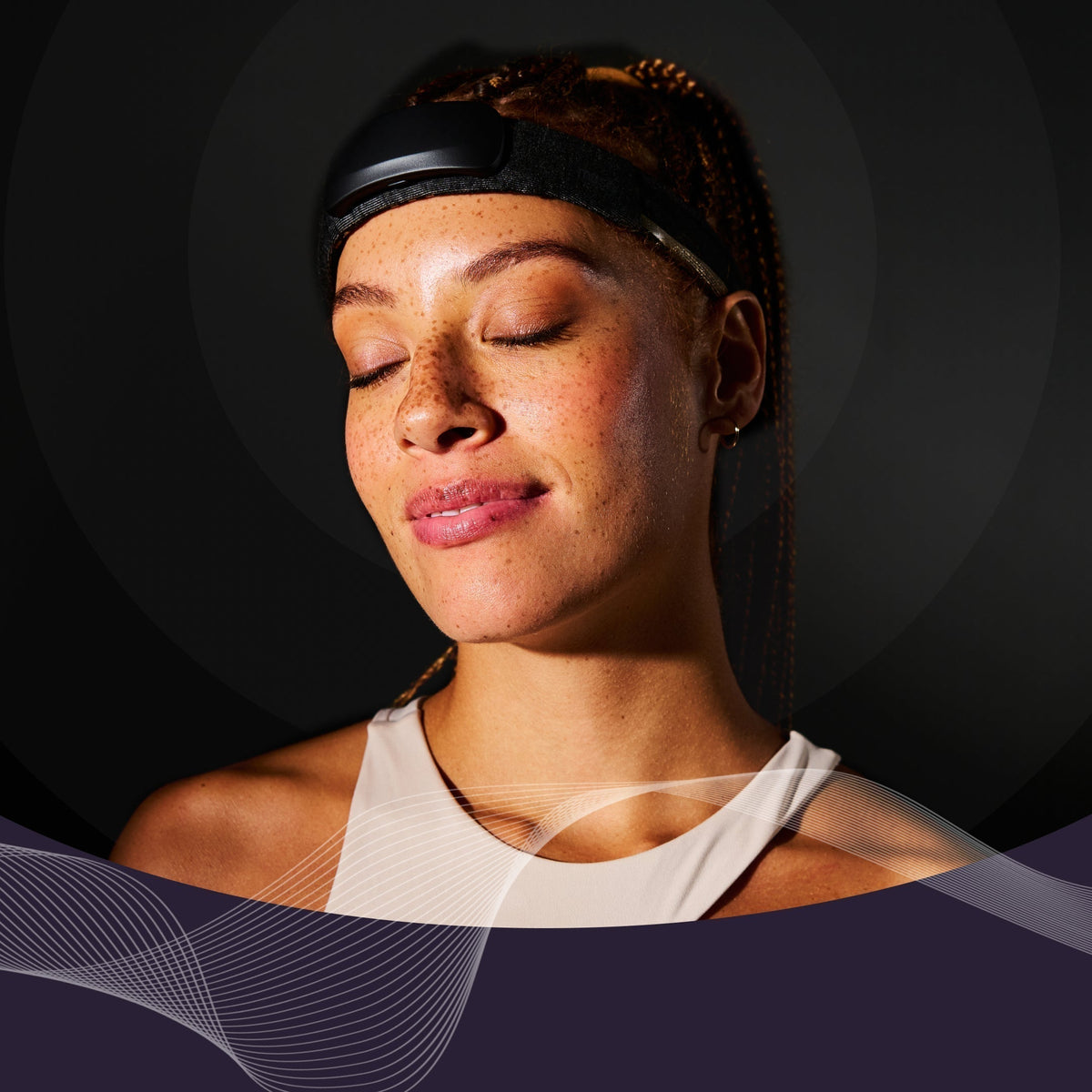 Person wearing a Muse EEG headband with eyes closed, relaxed expression against a dark background with abstract wave graphics