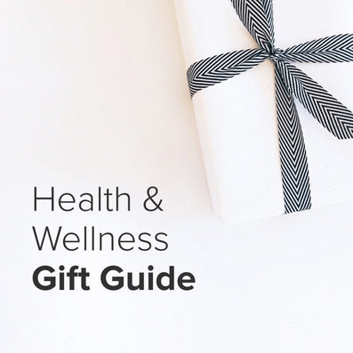 Wrapped white gift with black-and-white herringbone ribbon; text on image reads: Health & Wellness Gift Guide
