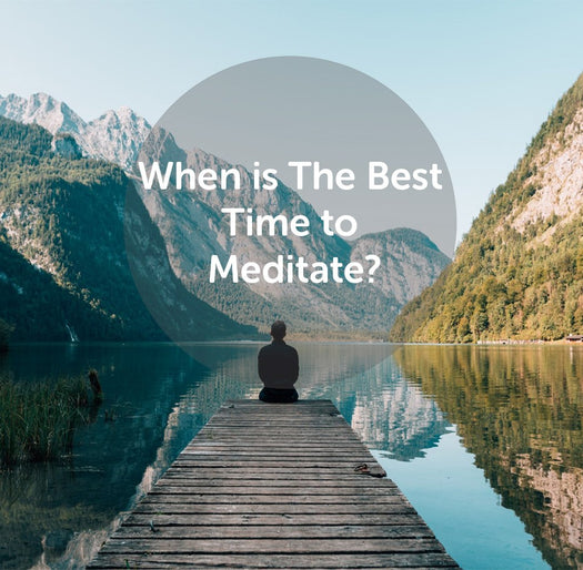 Person sitting on a dock facing a mountain lake; overlaid text: 'When is The Best Time to Meditate?'