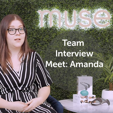 Amanda, product designer, seated by 'muse' sign with product box; on image text: Team Interview Meet: Amanda