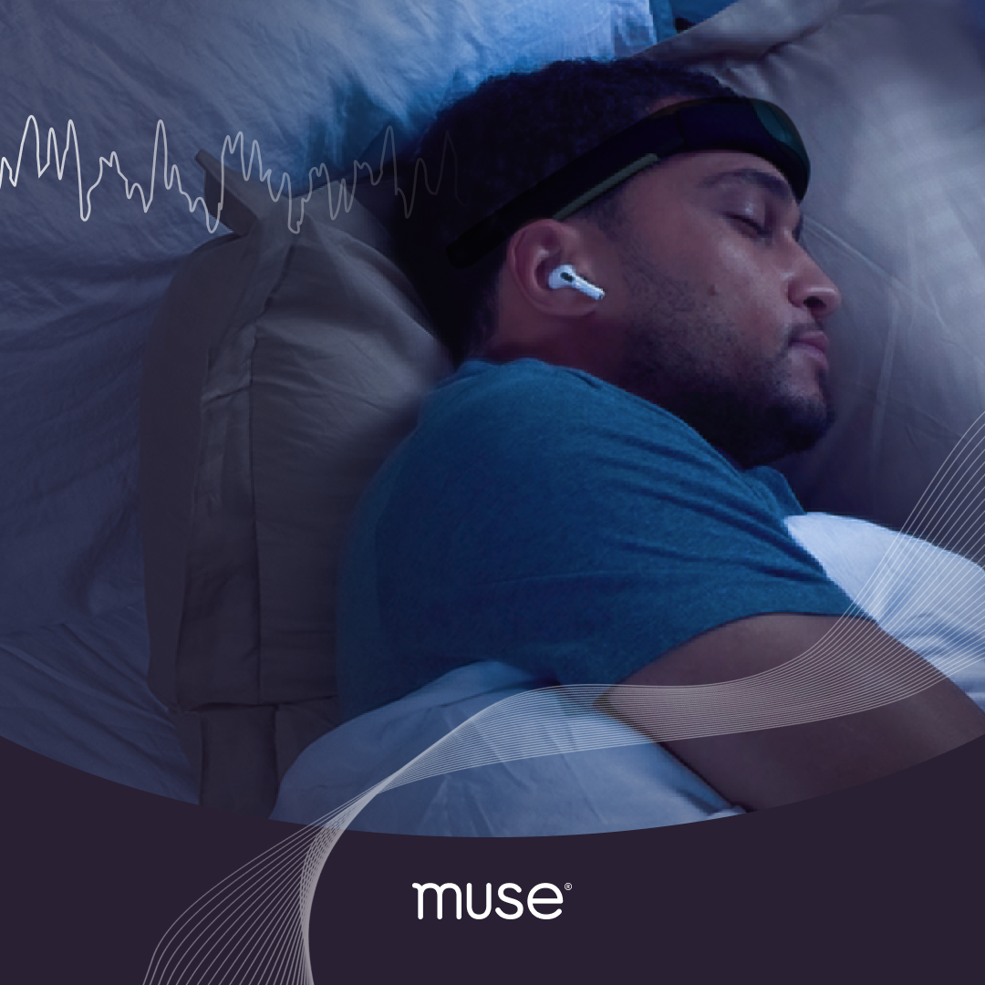 Man sleeping while wearing a Muse headband and earbud on a pillow, dark bedroom with EEG waveform overlay and Muse logo