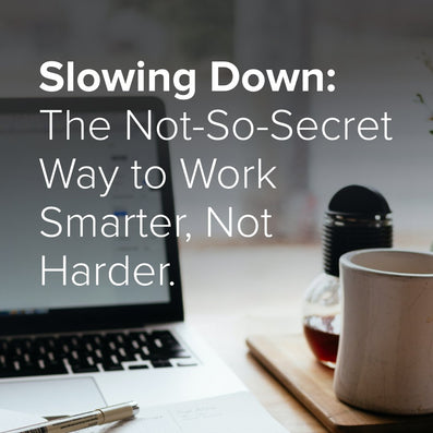 Slowing Down: The Not-So-Secret Way to Work Smarter, Not Harder. Cover photo of a laptop, mug, and pen on a desk.