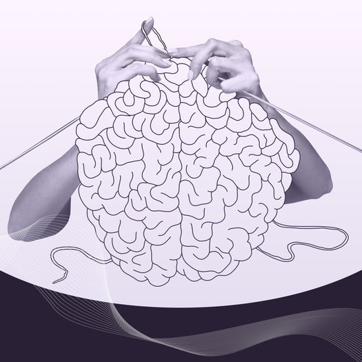 Hands knitting a brain-shaped ball of yarn in purple tones